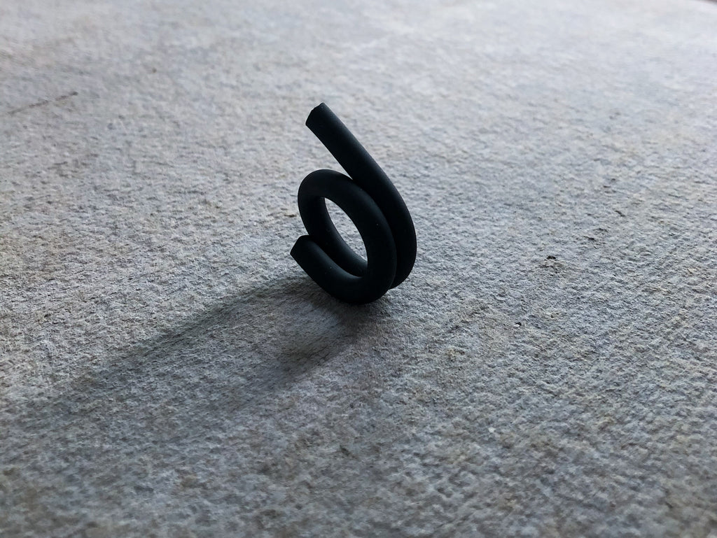 RUBBER TWISTED ASYMMETRICAL RING